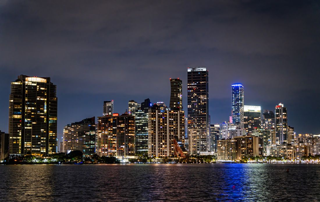 Miami skyline at night across the water